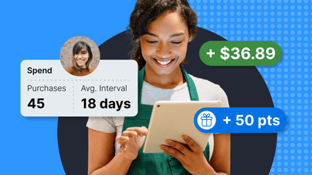 A woman looking at a tablet with loyalty information